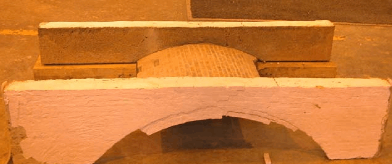 THE EFFECT OF SPANDREL WALL STRENGTHENING ON THE LOAD CAPACITY OF MASONRY ARCH BRIDGES