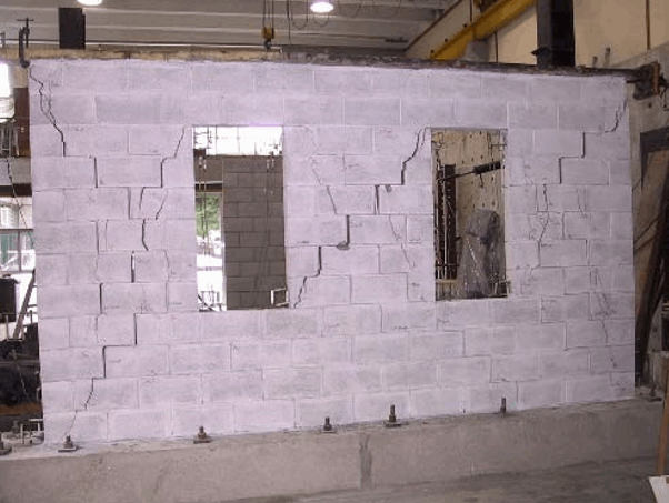 EXPERIMENTAL STUDY OF PARTIALLY GROUTED CONCRETE MASONRY WALLS WITH OPENINGS