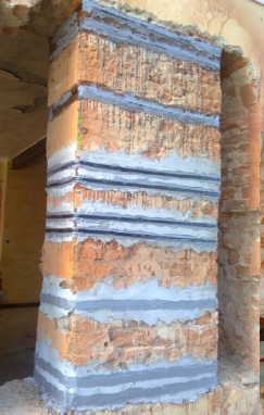 IN-SITU TESTED BRICK MASONRY WALLS STRENGTHENED WITH HORIZONTAL CARBON STRIPS AND FRP MESH