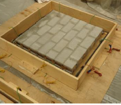 EXPERIMENTAL INVESTIGATION OF THE CONFINED MASONRY WALL PANELS